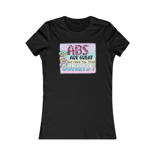 Chic black women's T-shirt displaying an artistic design with the phrase 'ABS ARE GREAT But Have You Tried DONUTS?', embellished with vibrant donut graphics, ideal for a stylish casual ensemble.