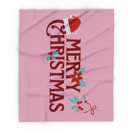 Decorative and Warm Christmas Arctic Fleece Blanket showcasing a whimsical 'Merry Christmas' design adorned with a Santa hat and seasonal decorations in a charming pink hue.
