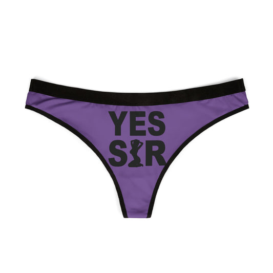 Chic purple thong designed for women, prominently displaying the phrase 'YES SIR' in striking black typography, perfect for playful romantic occasions.