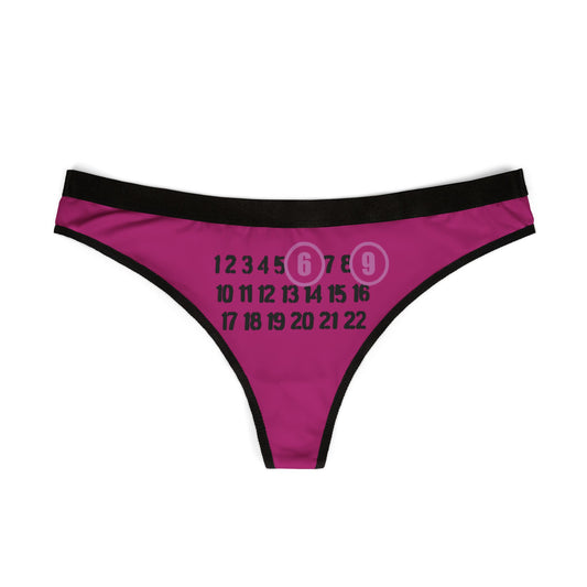Elegant Cheeky 69 Thong displayed flat, showcasing its provocative design with playful numbers in a chic colour palette of pinkish-purple and black.