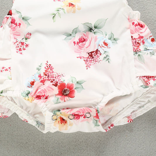 Detail of the bottom closure of the Luxurious 100% Cotton Floral Romper for Baby Girls, showcasing snap buttons for easy dressing and comfort for summer wear.