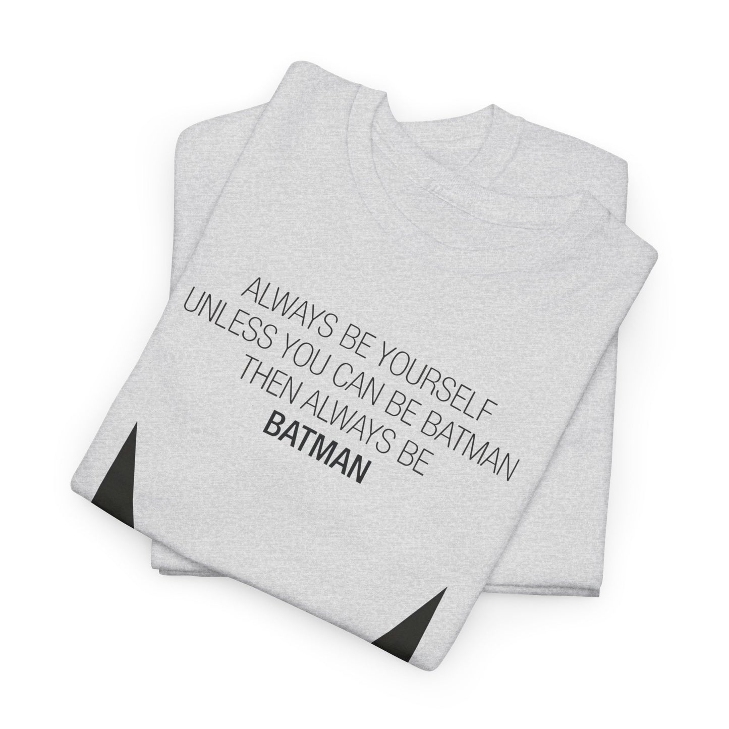 Folded Always Be Yourself Graphic T-Shirt in grey, elegantly showcasing its modern design and motivational text, perfect for discerning fashion enthusiasts.
