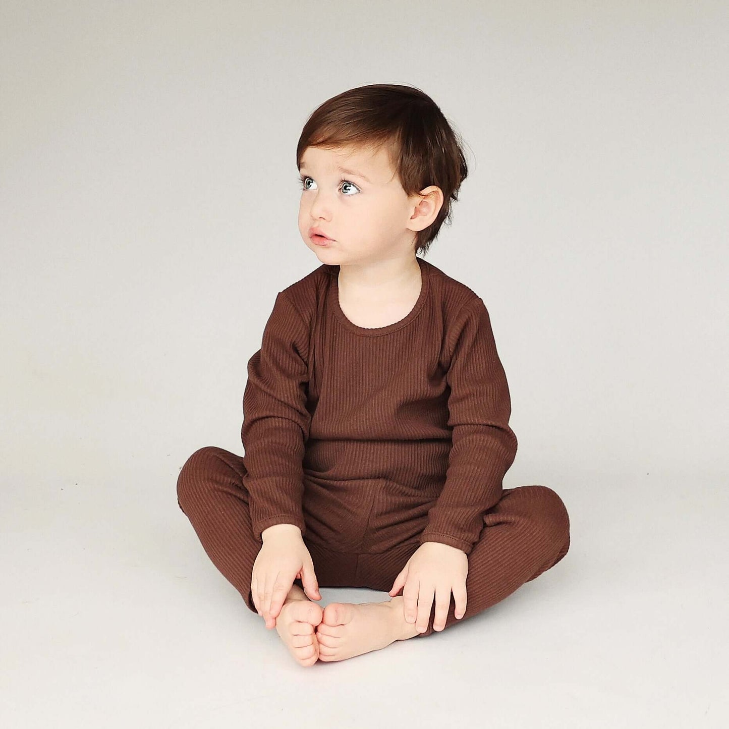 DreamBuy's matching chocolate pajamas for families, showcasing a chic pullover style with elastic waist for ultimate relaxation in any season.