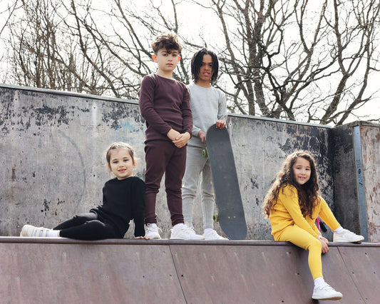 Elegant DreamBuy matching Christmas pyjamas in a vibrant aubergine colour, perfect for family gatherings, featuring soft cotton-blend fabric for a stylish and cosy fit.