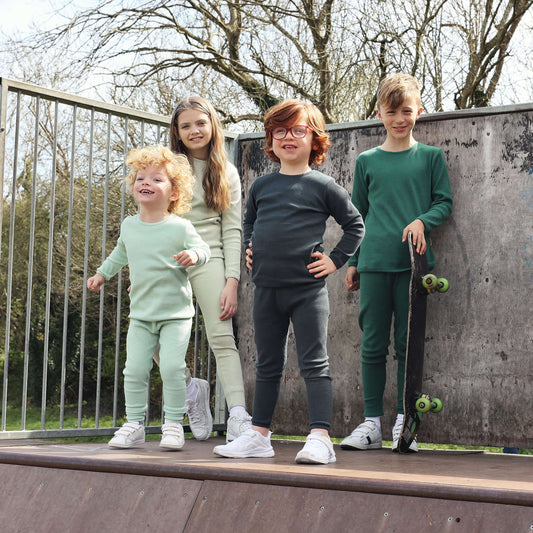 DreamBuy Pine Family Matching PJs in soft cotton, showcasing a luxurious selection of matching sleepwear for the whole family from newborn to adult XXL.