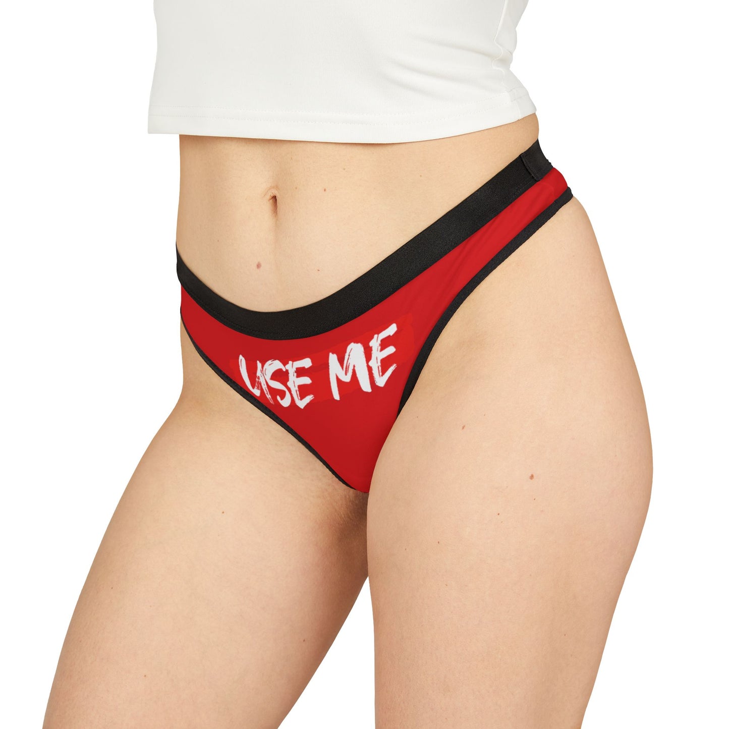 Chic red thong with contrasting black trim and bold lettering, ideal for celebrating special occasions in style.