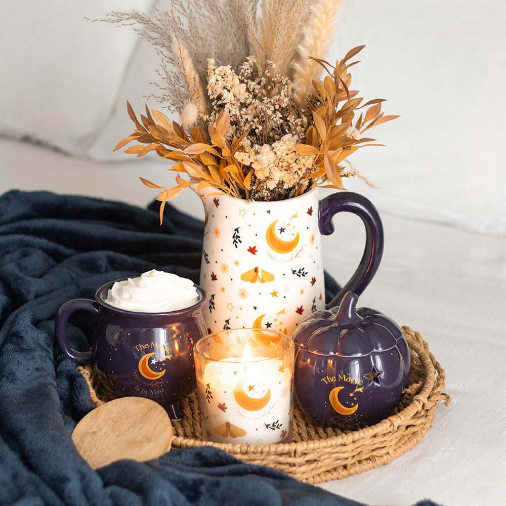 Luxurious midnight-blue cauldron mug featuring shimmering golden stars and a crescent moon, ideal for enriching your coffee and tea rituals with an enchanting touch.