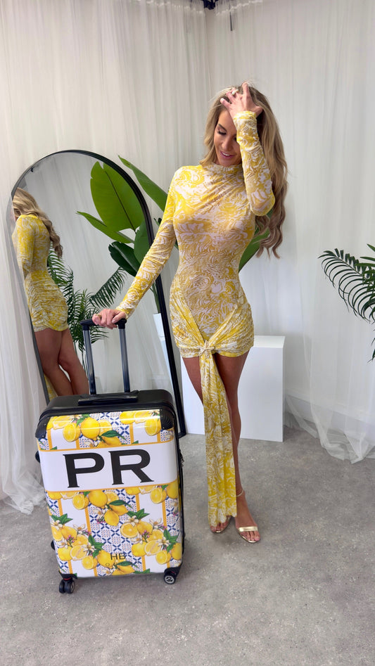 Close-up of the exquisite starfish brooch detail on the Santorini dress, offering a luxurious touch to this summer attire.