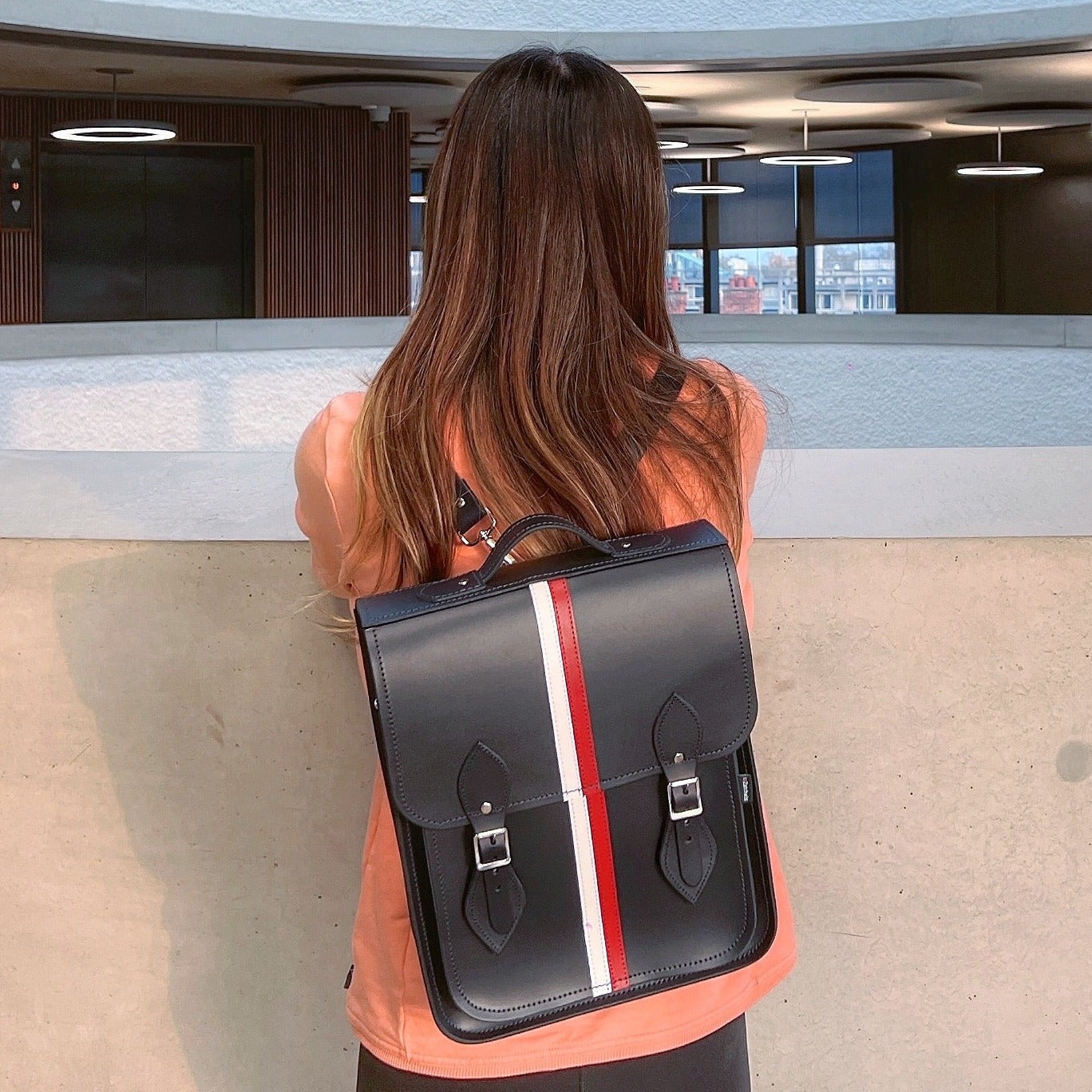 Versatile Handmade Leather City Backpack with adjustable straps and customizable fastening options, elegantly designed for comfort and practicality.