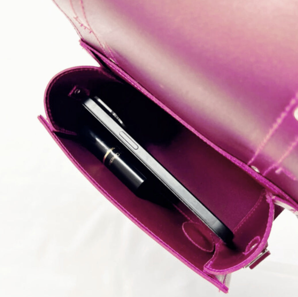 Stylishly customizable Zatchels Leather Bowler Bag with detachable crossbody strap, capturing a blend of tradition and contemporary elegance.