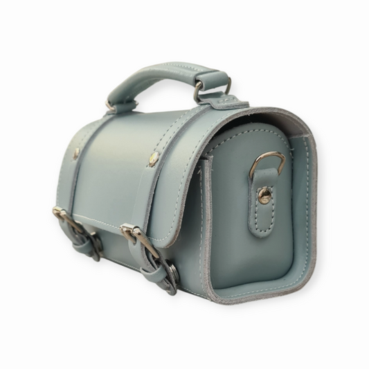 Elegant and versatile Zatchels bowler bag in sea green leather, featuring a detachable crossbody strap and classic cylinder shape.