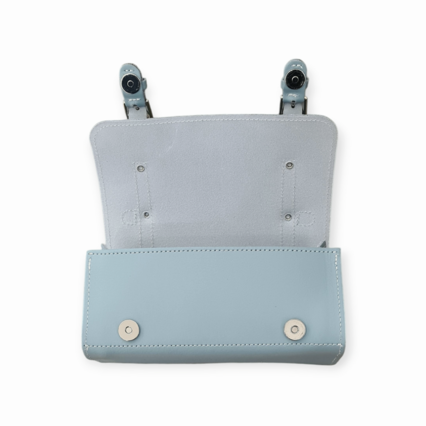 Versatile and stylish sea green leather bowler bag worn as a crossbody, demonstrating functionality and modern elegance in luxury accessories.