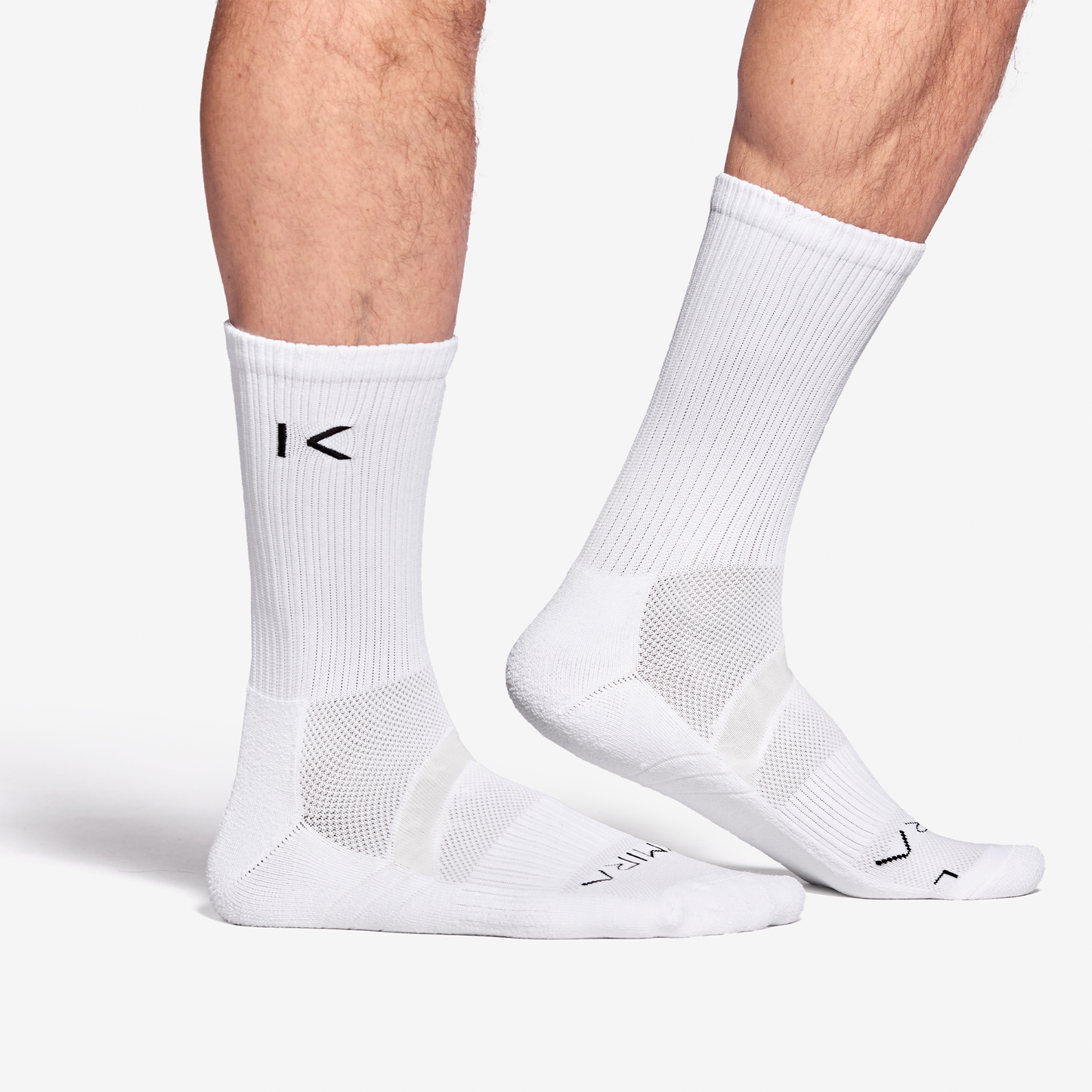 Luxurious KYMIRA Infrared Performance Crew Socks in White, designed for optimal comfort and recovery, available in sizes S (3-5), M (6-8), and L (9-11).