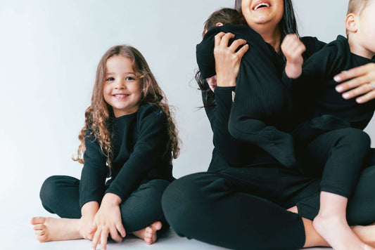 Luxurious soft ribbed women’s and children’s matching pyjamas by DreamBuy, designed for comfort and style, ideal for festive family gatherings.