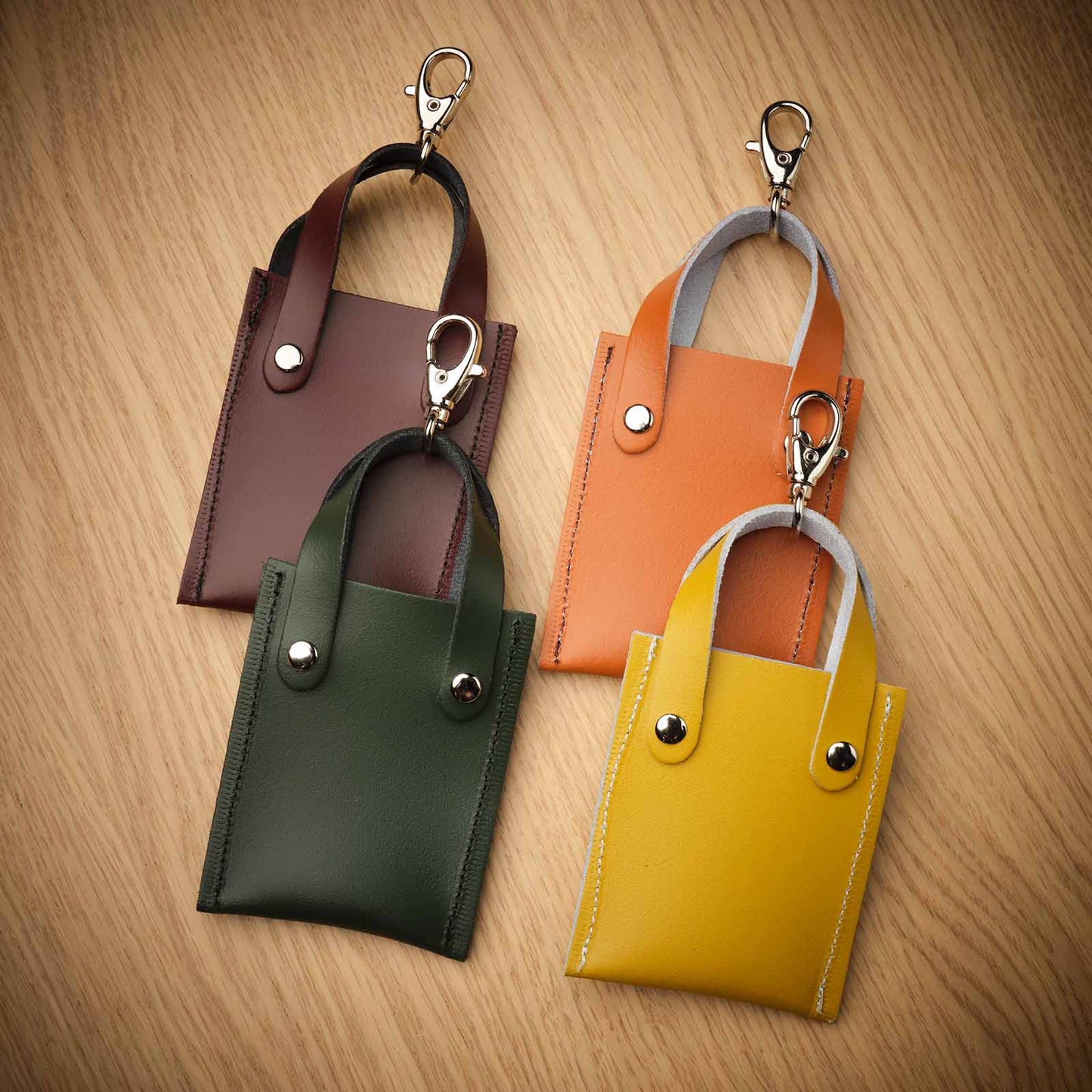 Luxury Marsala Red Mini Tote Bag Charm in handcrafted leather, showcasing superior craftsmanship and elegance against a soft backdrop, ideal for enhancing any handbag or accessory with a touch of sophistication.