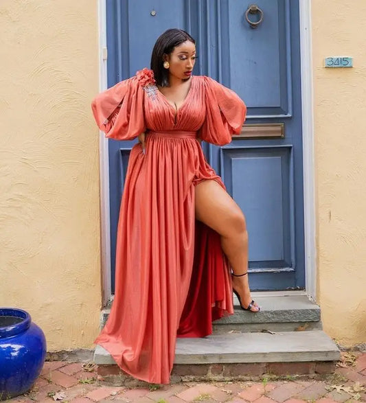 Elegant polyester kanga dress showcasing intricate patterns, designed for women with style and sophistication, offered in multiple sizes.