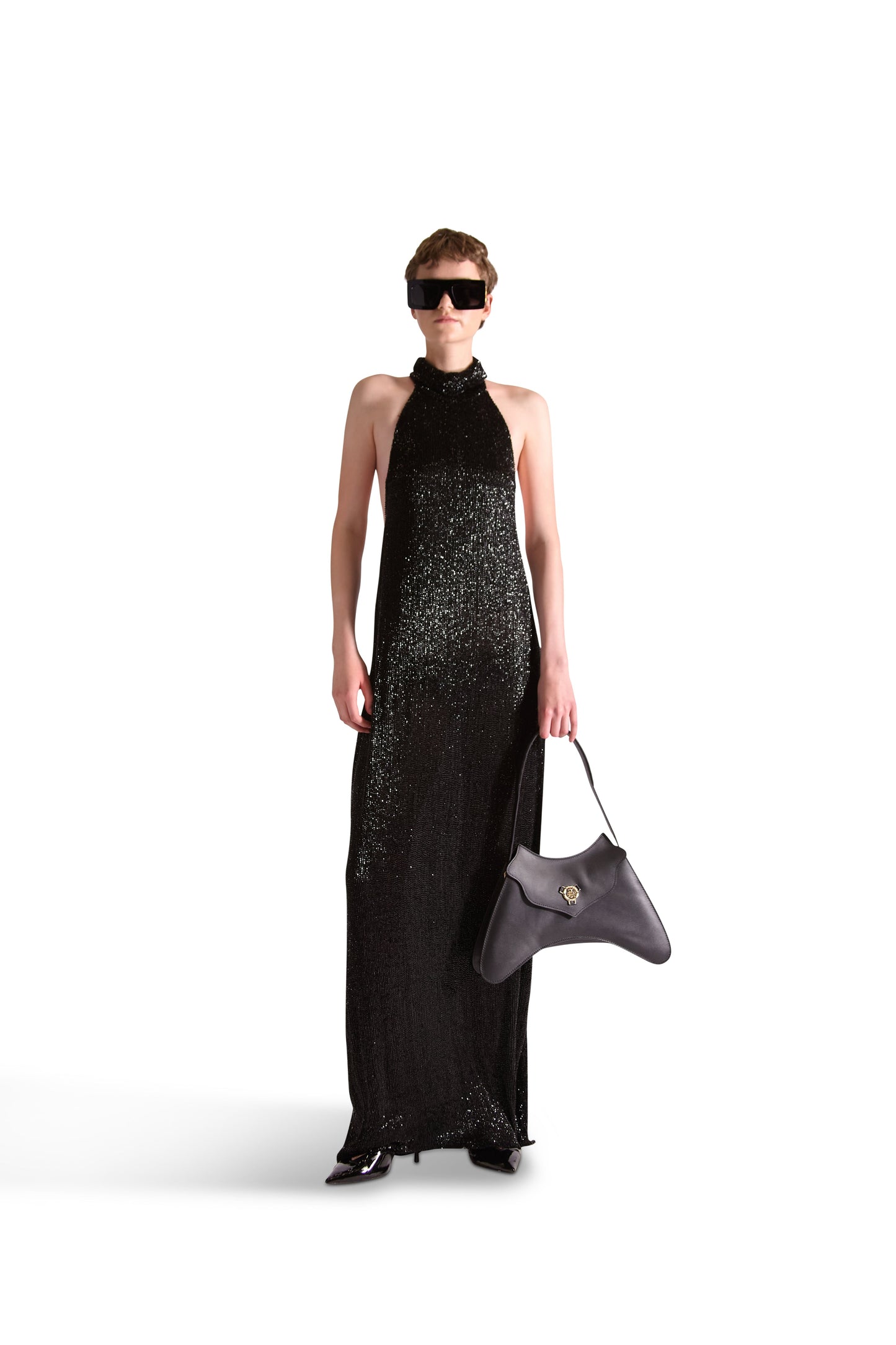 Gorgeous floor-length backless evening dress designed by Helen Anthony, embodying luxury and timeless elegance.