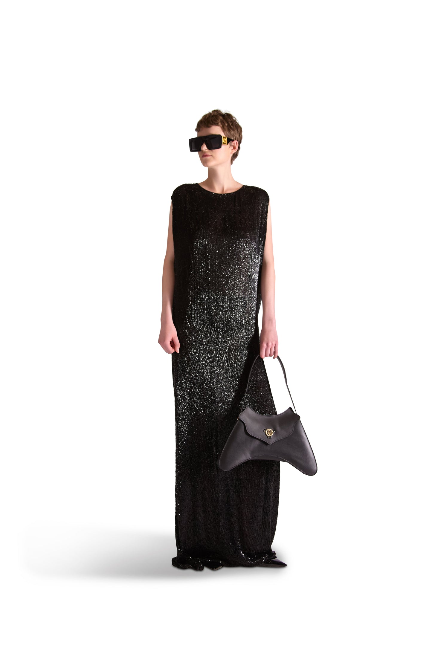 Showcasing the flowing silhouette of a luxury hand embroidered evening dress ideal for elegant events.