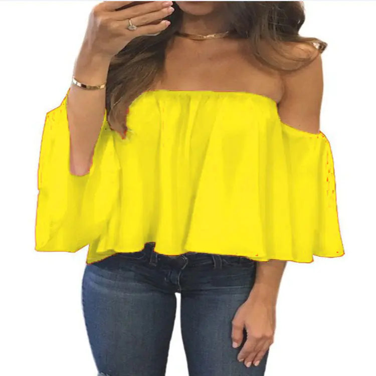 Stylish yellow chiffon blouse with a billowing off-shoulder cut, beautifully paired with jeans for an elegant look.