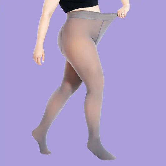 Luxurious Women's Fleece Lined Tights in a versatile grey hue being pulled up, highlighting their elegant design and comfortable fit for all-day wear.