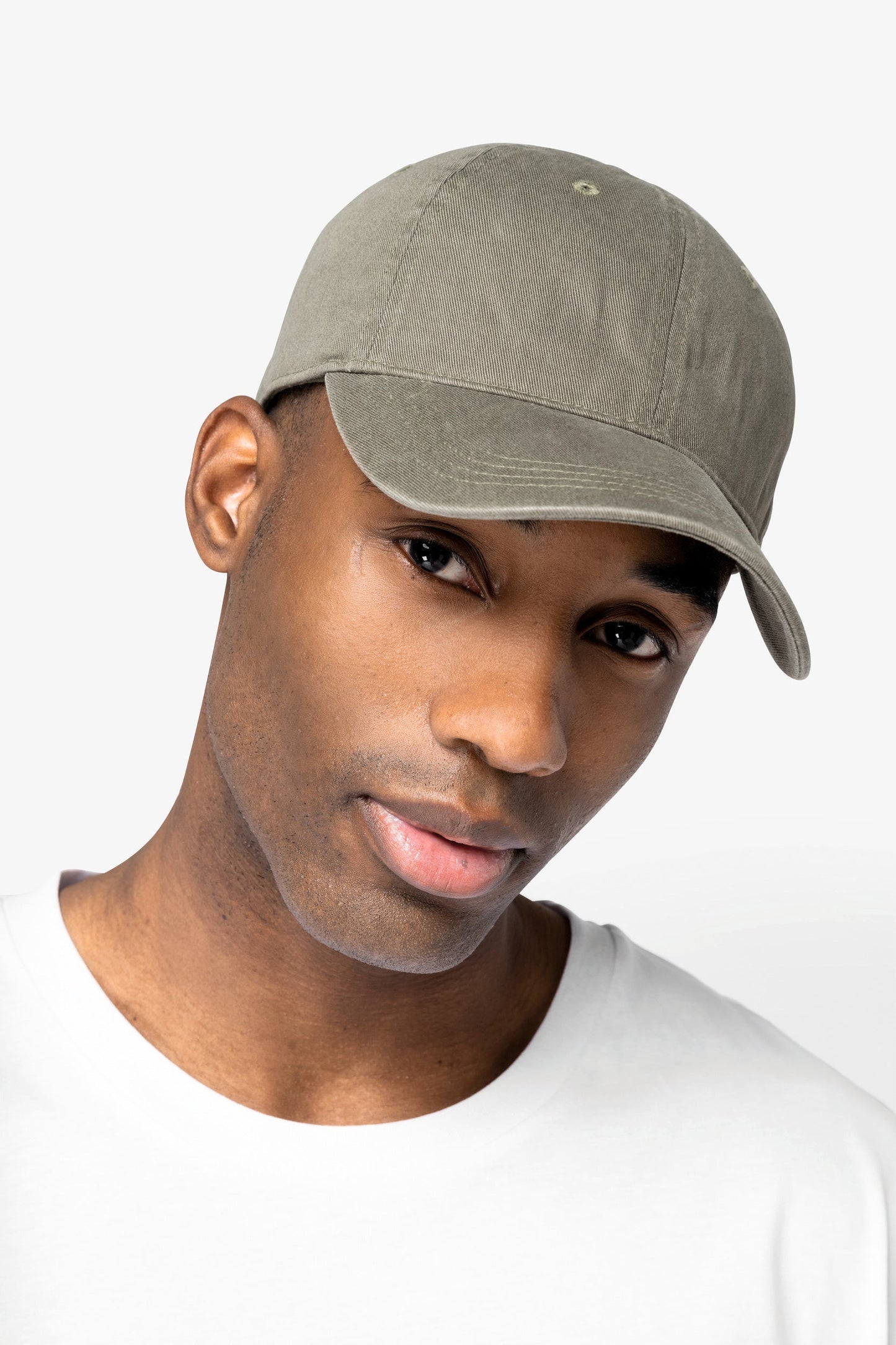Luxury organic cotton faded cap folded neatly, illustrating its high-quality craftsmanship and unique faded appearance.