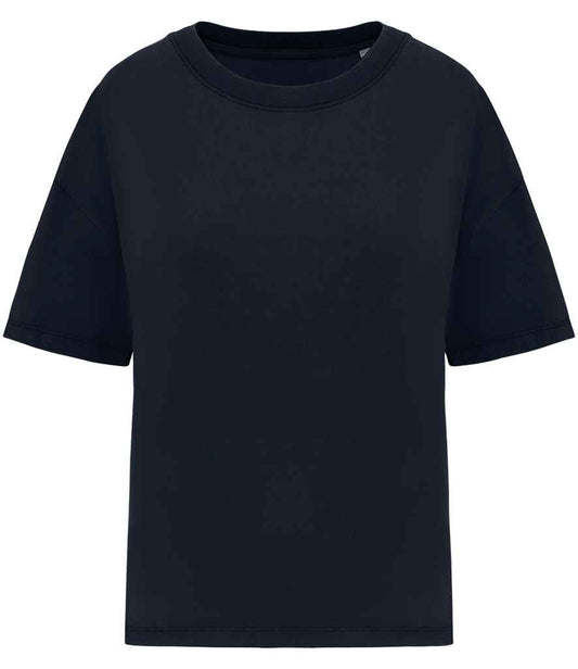 Close-up of luxury oversized t-shirt for women in organic cotton, highlighting the pre-washed finish and distinct color variation from the garment dyeing process.
