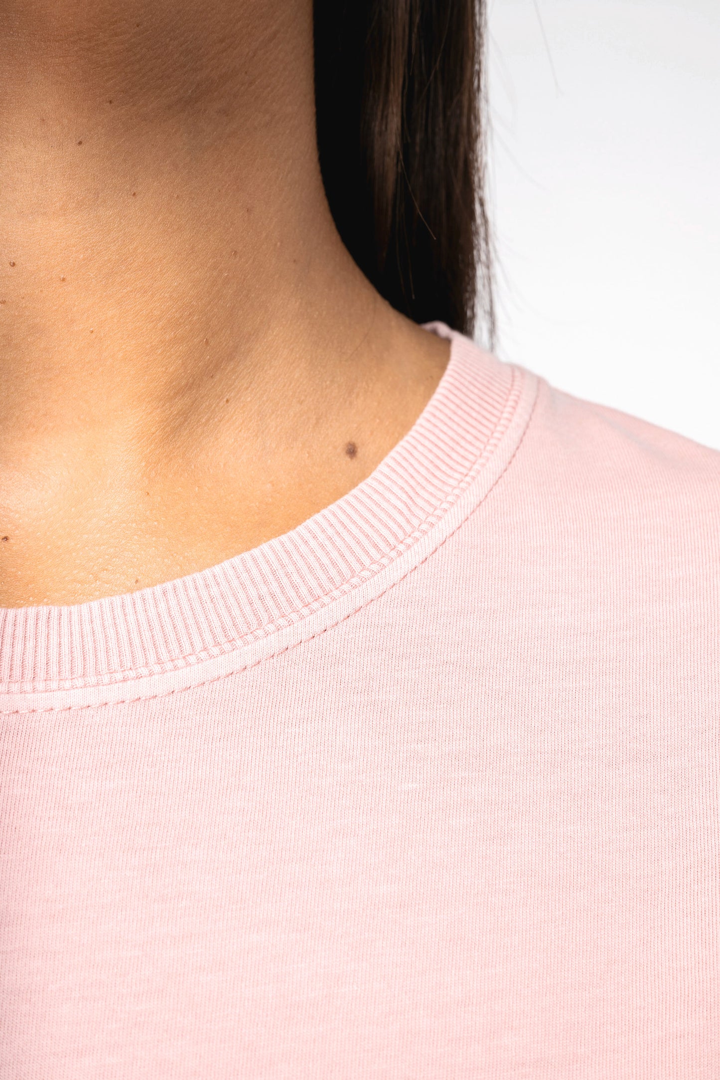 Detail view of luxurious organic cotton stonewash t-shirt dress, highlighting its premium fabric and effortless chic style suitable for any casual occasion.