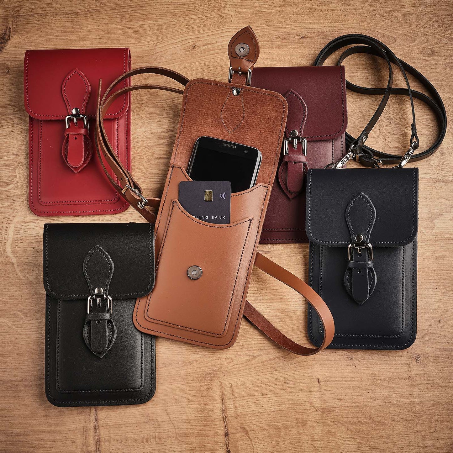 Luxury Handmade Leather Mobile Phone Pouch in vibrant magenta, featuring an adjustable crossbody strap, designed for stylish card and cash storage, measuring 14x22cm, ideal for elevating everyday accessories.