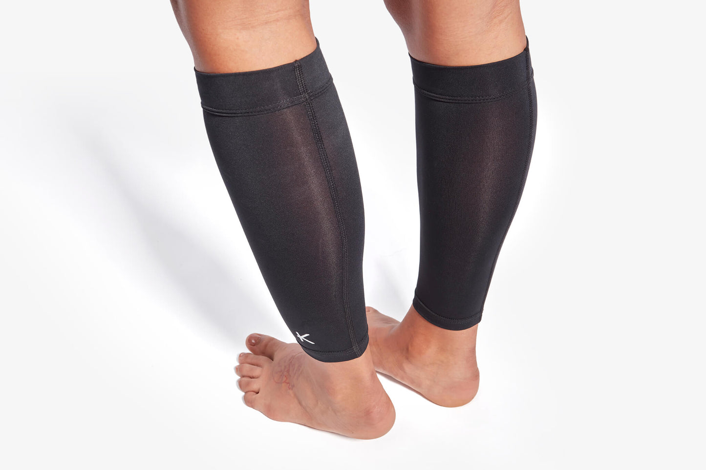 KYMIRA Infrared Pro Calf Sleeves showcasing innovative technology for improved blood circulation and muscular support in a refined, stylish design.
