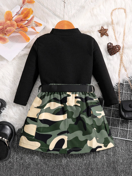 Detail shot of the black round neck long-sleeve top, part of a fashionable girls' clothing set for autumn, crafted from high-quality polyester.