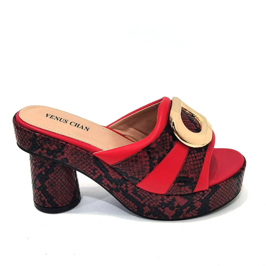 Stylish matching handbag with a metal handle and long chain shoulder strap, complementing the elegant red heels for women, ideal for special occasions.