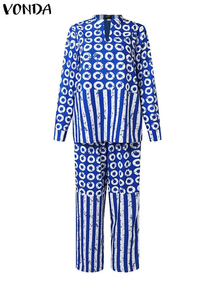 Luxury plus size women's matching set by VONDA in size 5XL, showcasing an artistic long sleeve shirt with polka dots and stripes, alongside tailored relaxed-fit elastic trousers.