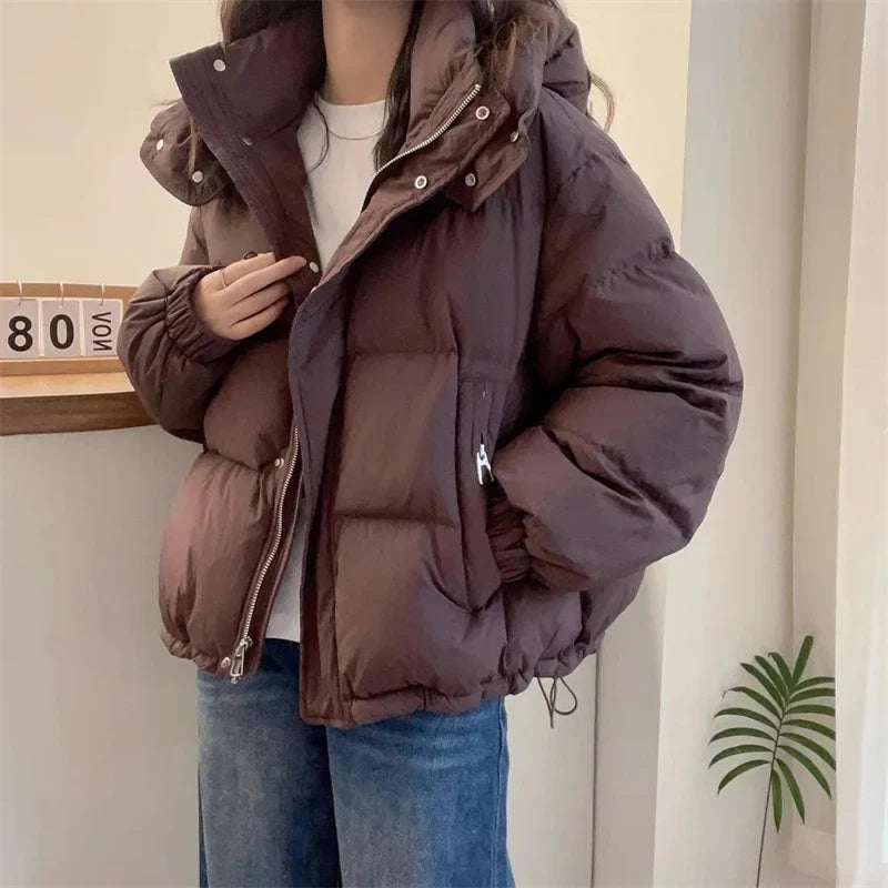 Winter-ready women's slim fit puffer jacket displayed beautifully, featuring solid colour design, hood, and premium craftsmanship, perfect for a luxurious winter wardrobe.