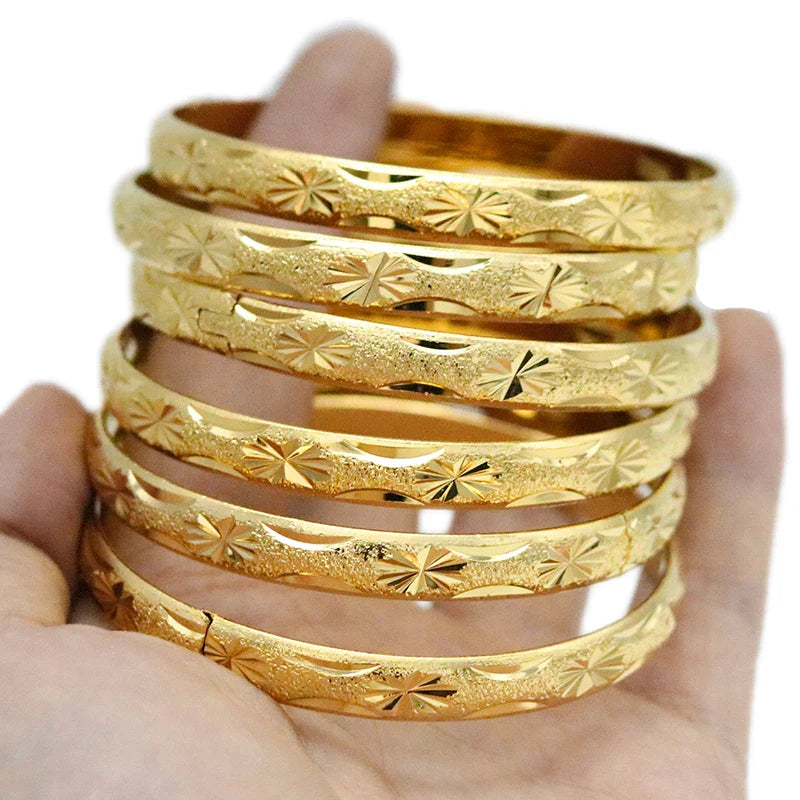 Beautifully crafted Saudi Arabian gold bangles, offered in a set of six, designed as ideal gifts for brides, enhancing wedding day elegance.