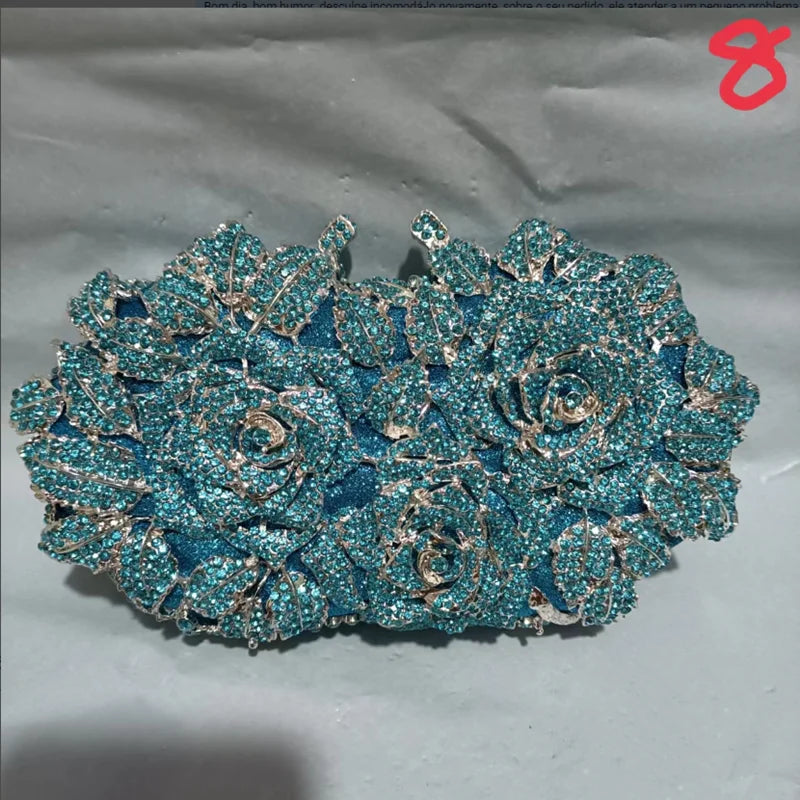 Luxury women's minaudière clutch evening purse crafted from metallic leather, featuring a sophisticated design adorned with sparkling crystal accents, perfect for glamorous occasions.