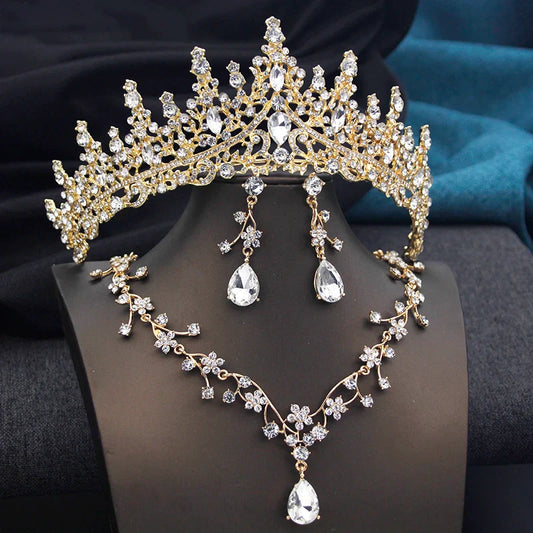Elegant opal green tiara adorned with crystals, complemented by matching necklace and earrings for a stunning bridal look.