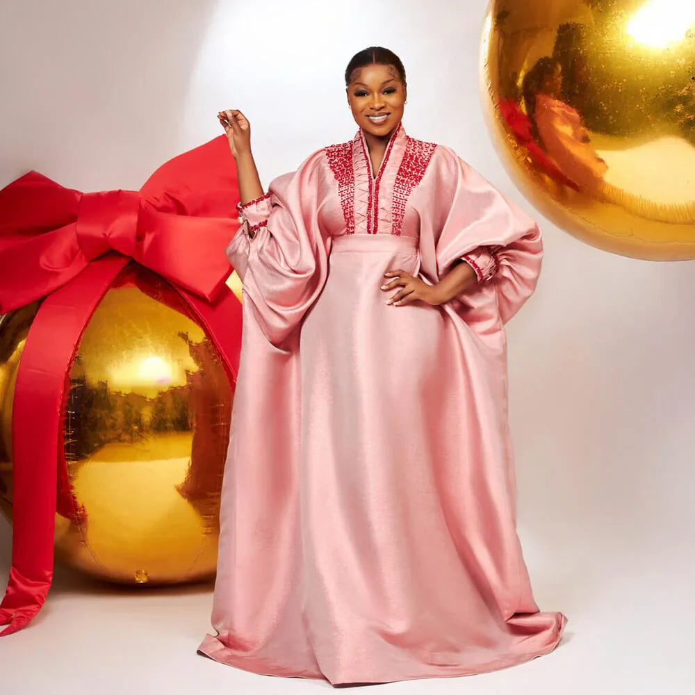 Luxurious polyester acrylic fabric dress for women, featuring a glamorous V-neck and intricate rhinestone detailing, perfect for traditional African occasions.