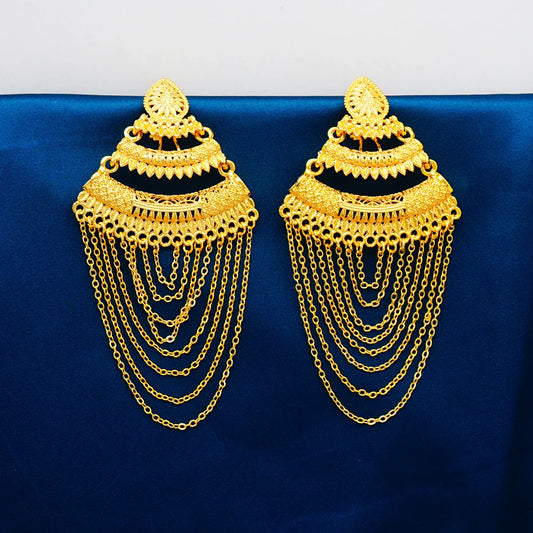 Close-up view of luxury geometric African gold colour earrings made of copper, embodying exquisite craftsmanship suitable for special occasions.