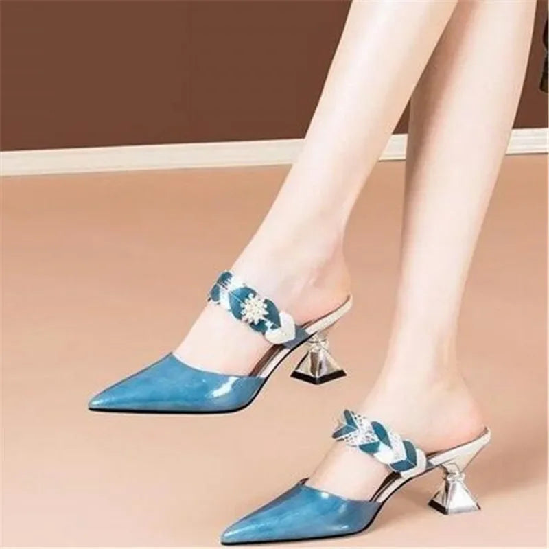 Chic geometric pattern on luxurious fur upper of women's designer slides, providing a sophisticated touch for fashionable ensembles.