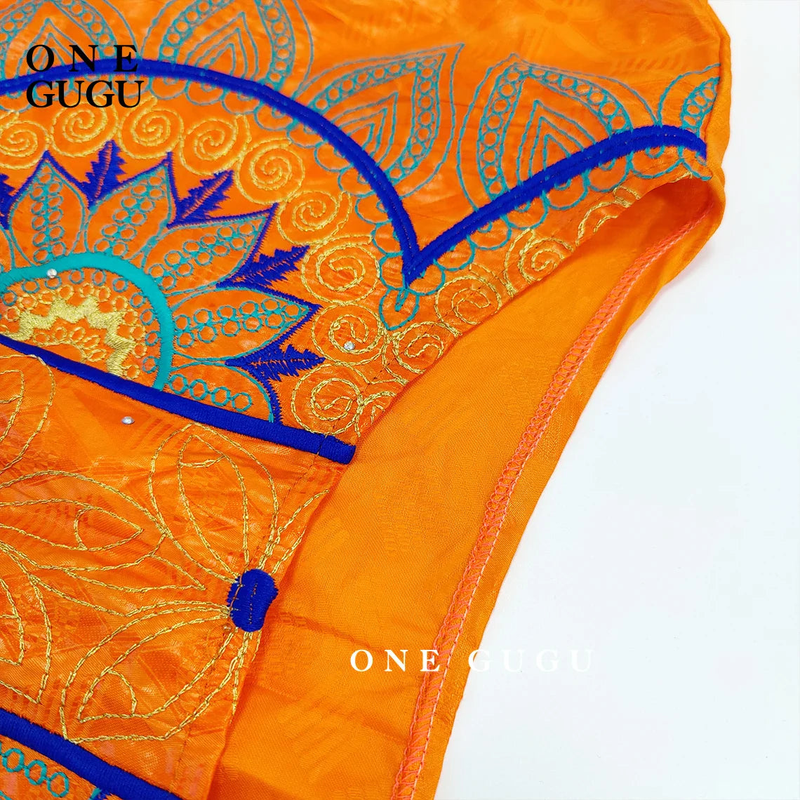 Luxurious elegant orange Bazin dress adorned with intricate embroidery lace, designed for women’s traditional Dashiki style, perfect for weddings and festive parties.