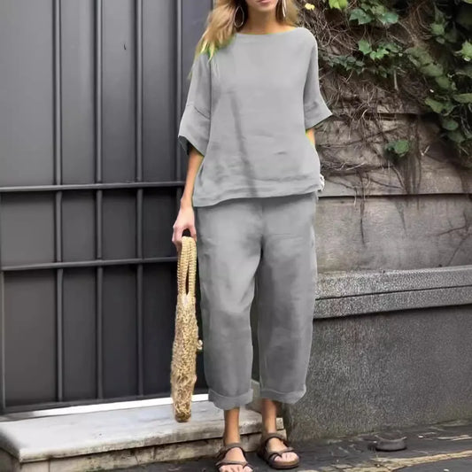 Close-up of luxury plus-size women's shirt showcasing O-neck collar and textured cotton-linen fabric for comfort and style.
