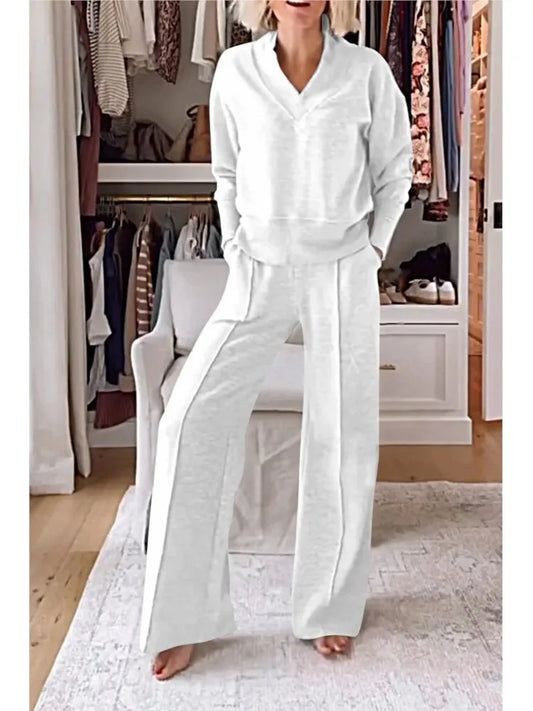 Elegant women's wide-leg pants and V-neck long sleeve casual set, crafted from soft polyester with pockets, ideal for autumn winter wear.
