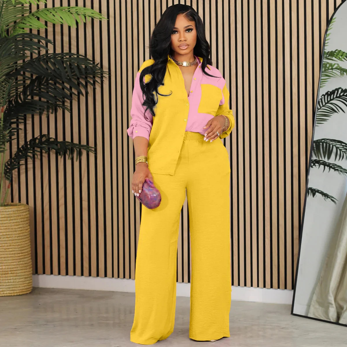 Stylish women's luxury tracksuit in patchwork design, showcasing high waist full-length trousers and a sophisticated turn-down collar for a refined look.