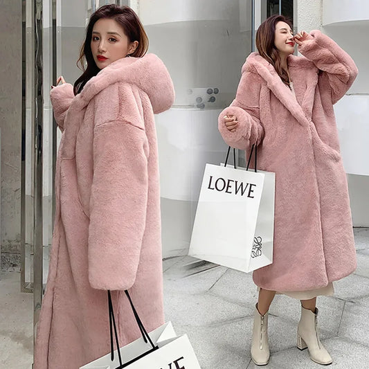 Opulent faux fur outerwear coat for women featuring single breasted closure and regular fit.
