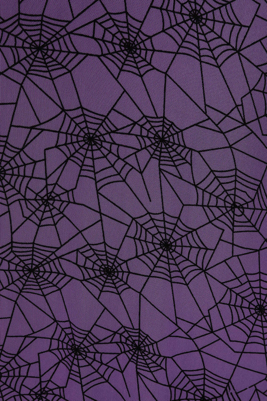 Close-up view of the intricate spiderweb pattern on the Banned Apparel Seraphina Mesh Skirt, highlighting the luxurious fabric texture and gothic aesthetic.