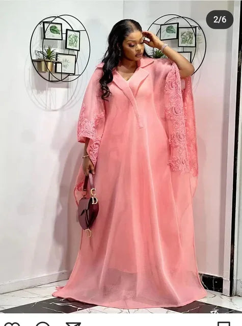 One-size-fits-all beautiful Dashiki gown in rich yellow and pink, embodying African cultural heritage with modern sophistication.