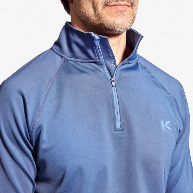 Lifestyle shot of Men's Kymira Infrared 1/4 Zip Top, featuring stylish design and exceptional comfort for the modern athlete.