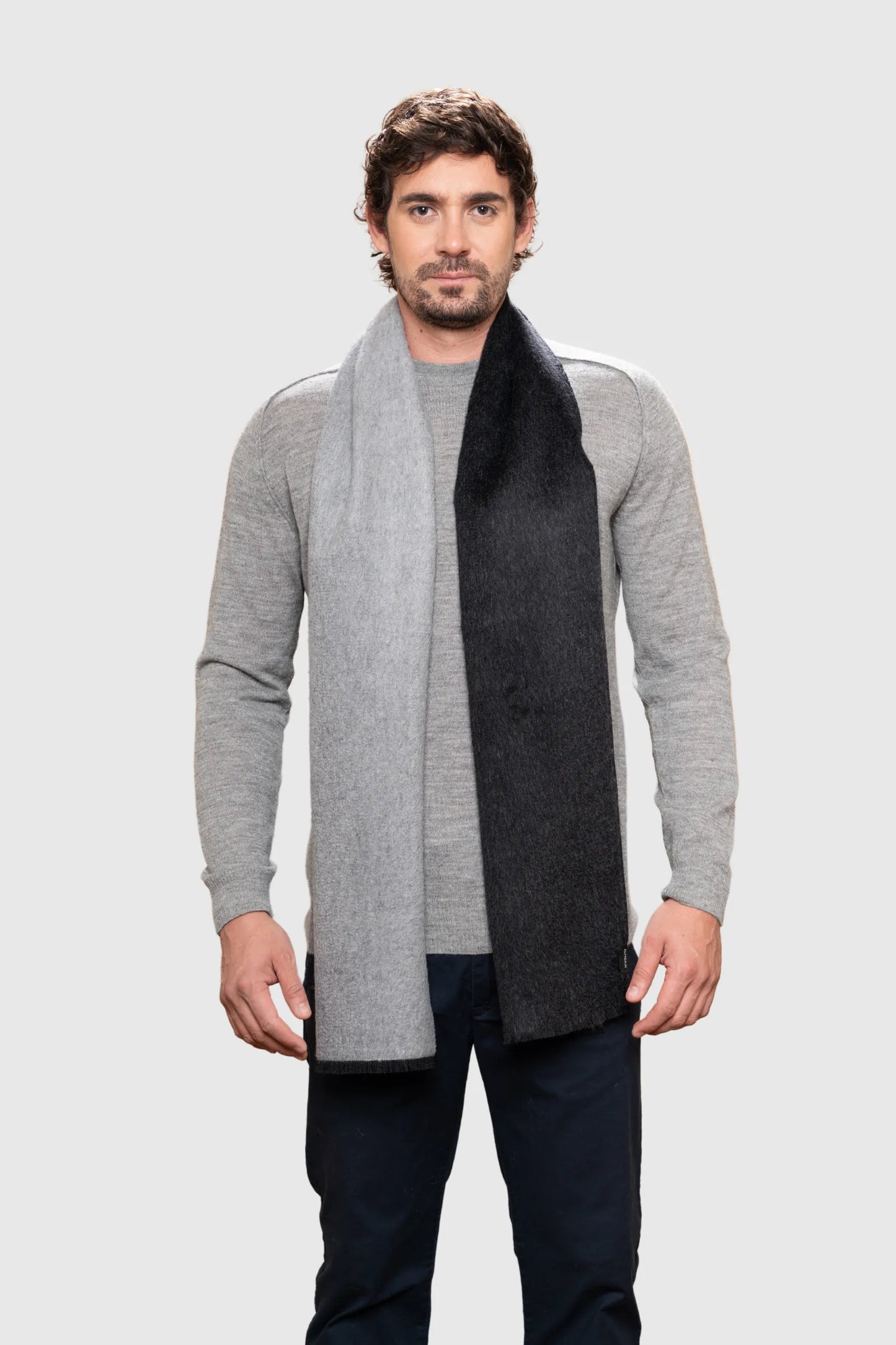 Luxurious two-tone baby alpaca reversible scarf with frayed edges, showcasing elegant soft fibres, perfect for chic winter styling.