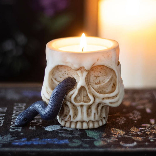 Artistic view of the enchanting gothic skull tealight holder entwined with a serpent, ideal for creating dramatic lighting and spooky atmosphere.