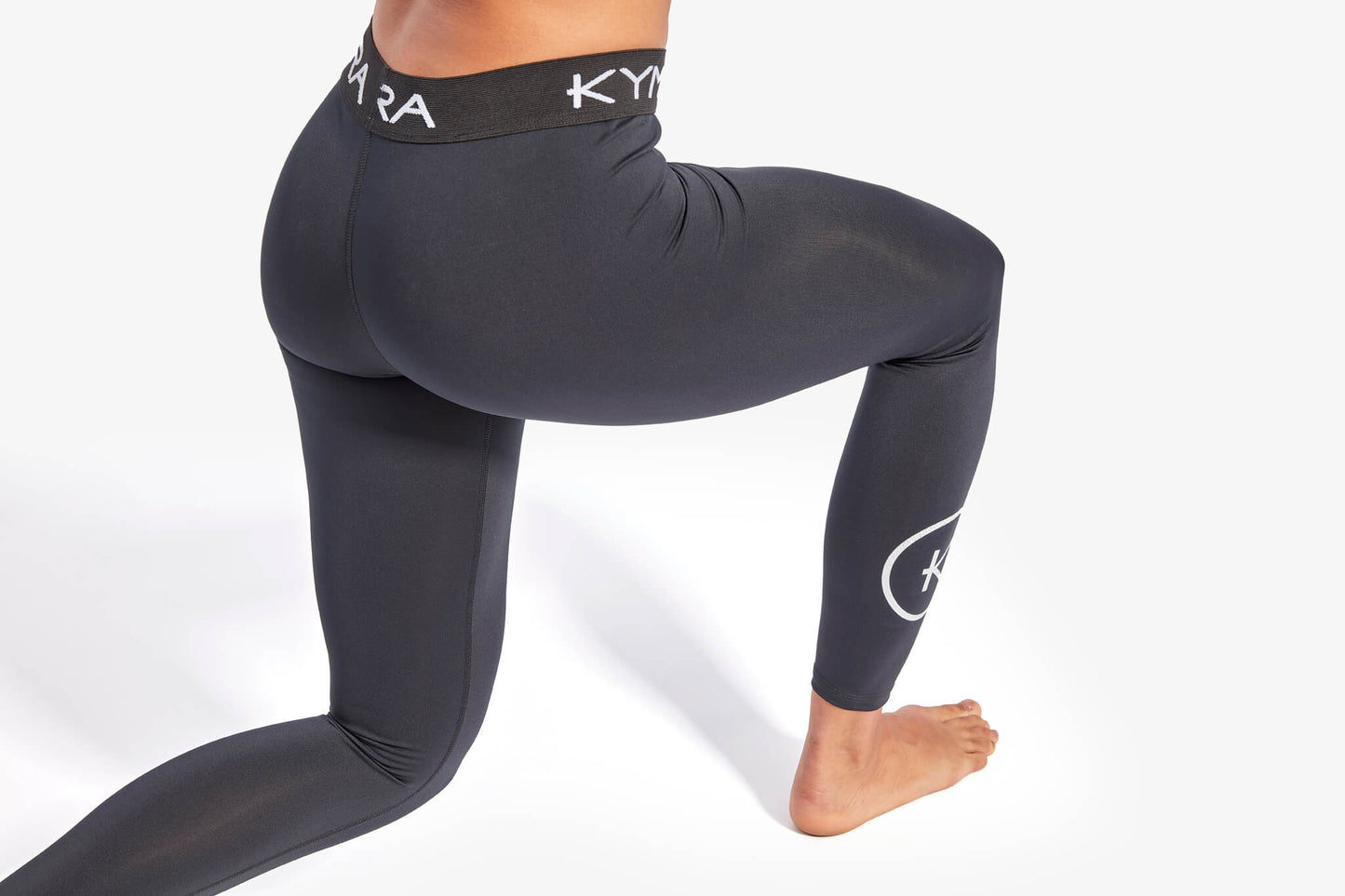 Luxury KYMIRA® Women's IR50 Infrared Recovery Leggings designed for comfort and performance, featuring breathable fabric, elasticated waistband, and fitted calves; available in sizes XS-XL.